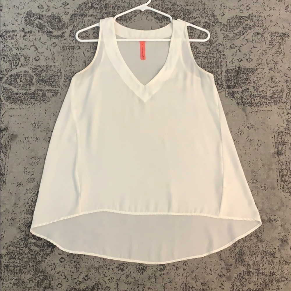 White flowy V-neck high low top